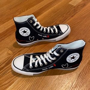 Custom black “made with love” high top converse with red and white embroidery.